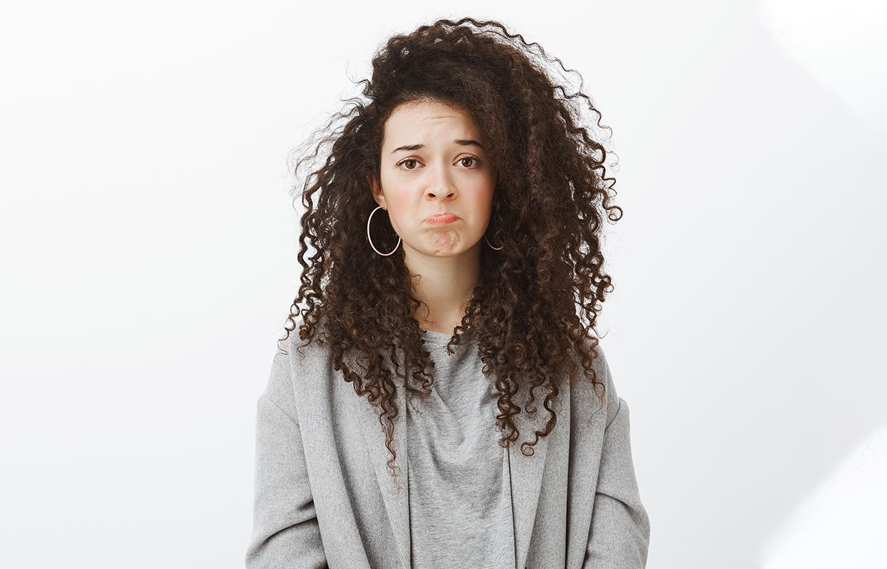a girl will frizzy hair in winters