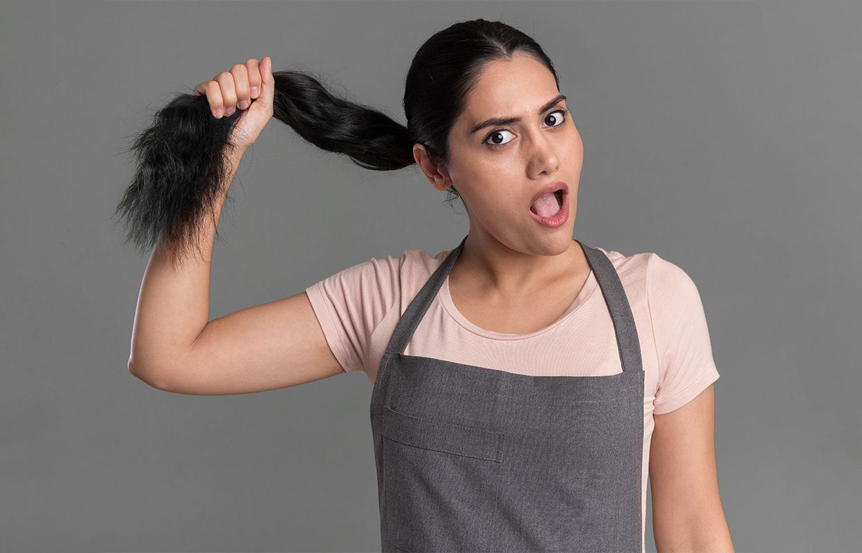 A woman stretching her hair-showing strength