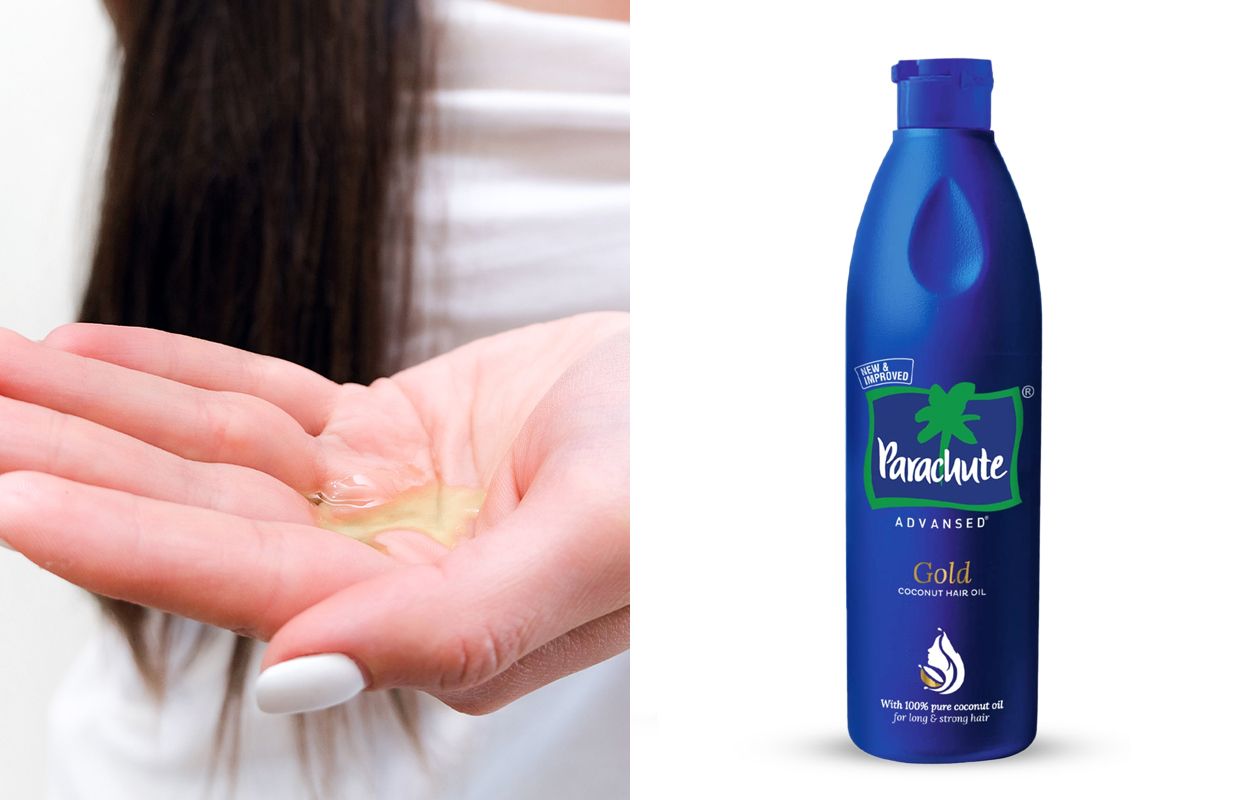 Woman pouring Parachute Advansed Gold Coconut Hair Oil into her palm