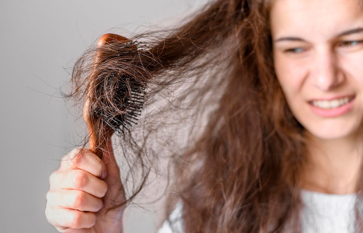 Women annoyed with her frizzy hair 